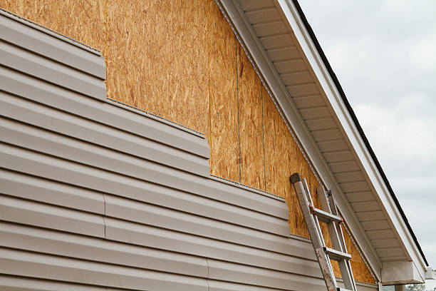 Professional Siding Contractor technician working in Springs, NY